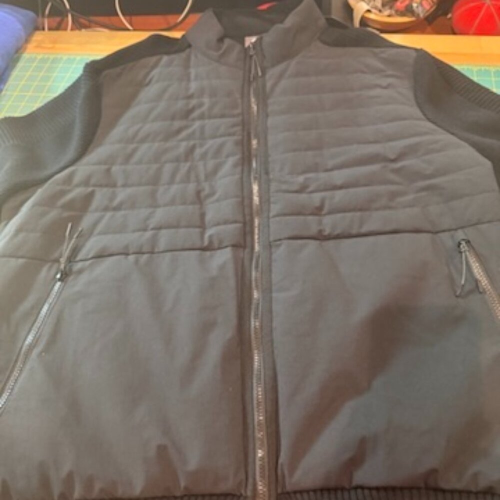 Men's 2X full zip sweater jacket with windproof, quilted and padded front layer.